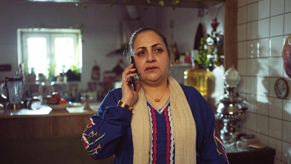 Person making a confidential call to an outpatient treatment center from home