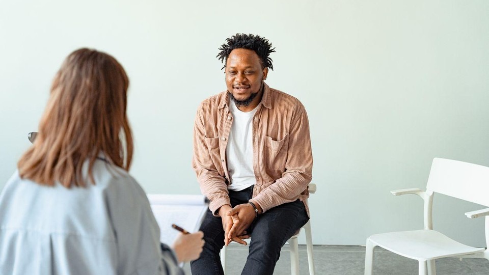 Person meeting with a clinician to start medication-assisted treatment for opioid use disorder