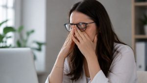 Relapse Triggers hero image of a woman fighting through the temptation to use substances again.