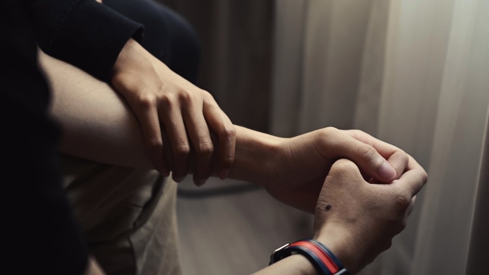 Why Do Addicts Relapse When Things Are Good someone supports their friend after suffering from addiction.