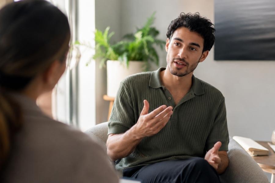 a client talks through service options during addiction intake.
