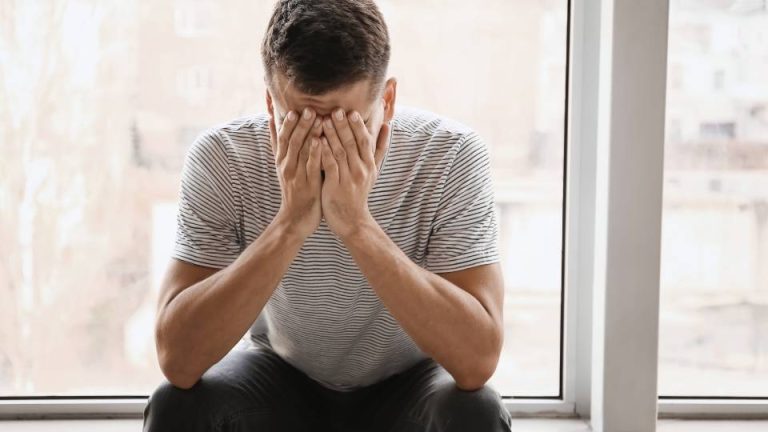 How Does Alcohol Affect Mental Health hero image of a man dealing with mental health issues.