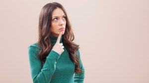 Is Partial Hospitalization Considered Outpatient Care hero image of a woman thinking.